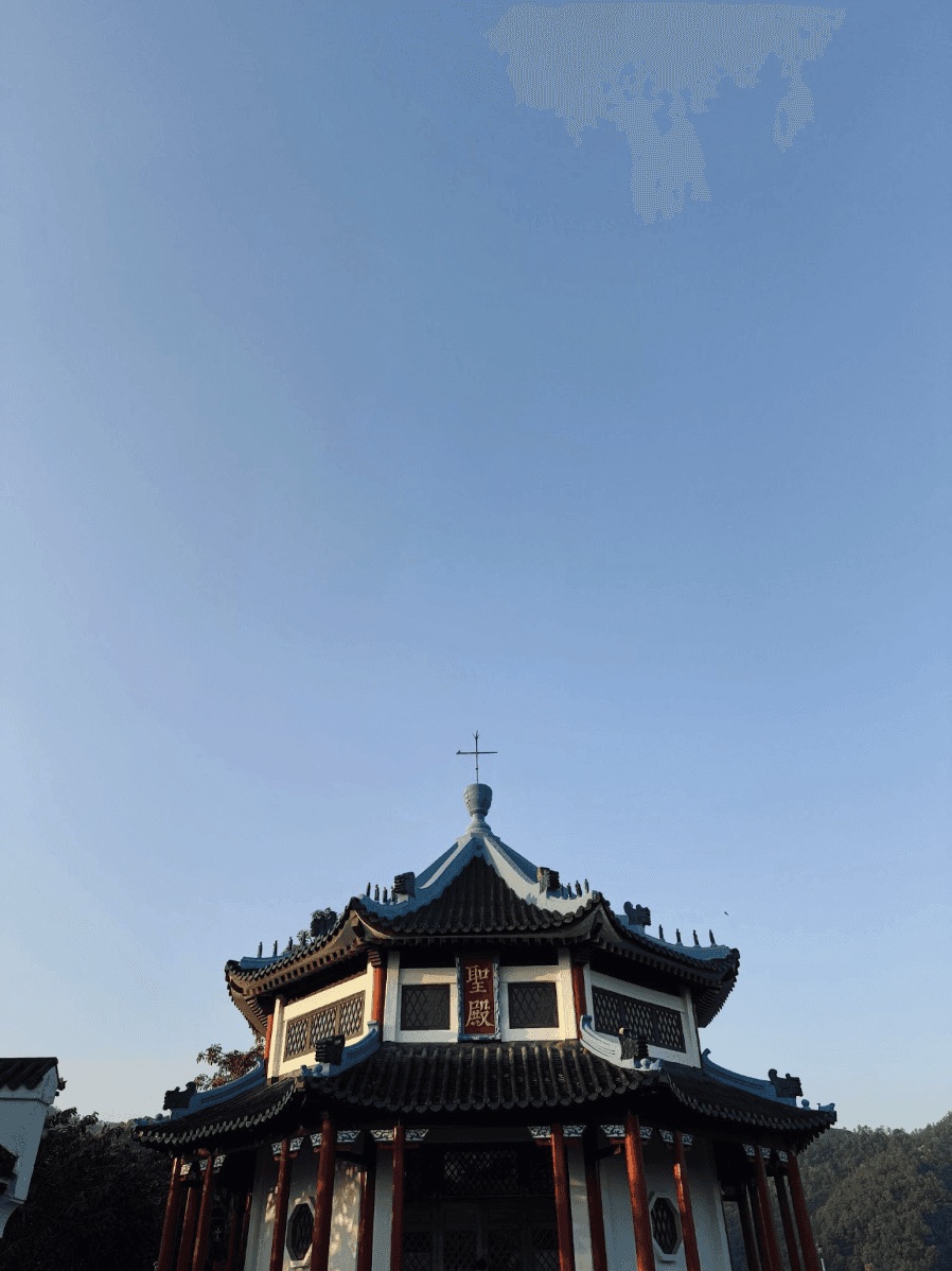 Red pagoda against a clear blue sky
